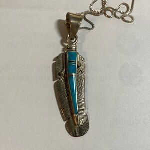 Sterling Calvin Begay feather pendant on 18” 925 chain.